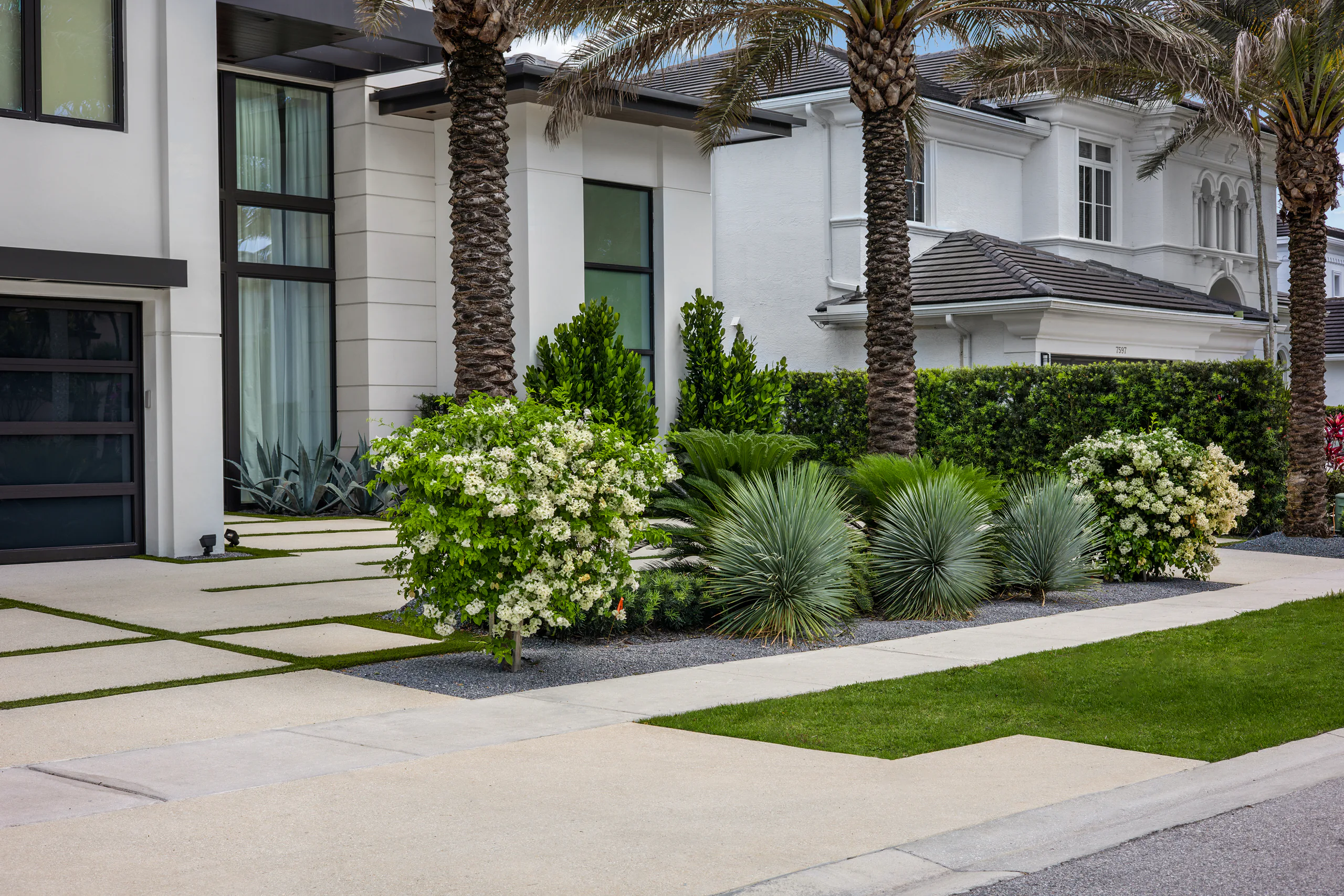 An estate driveway and frontage planting maintained by Power Group Care