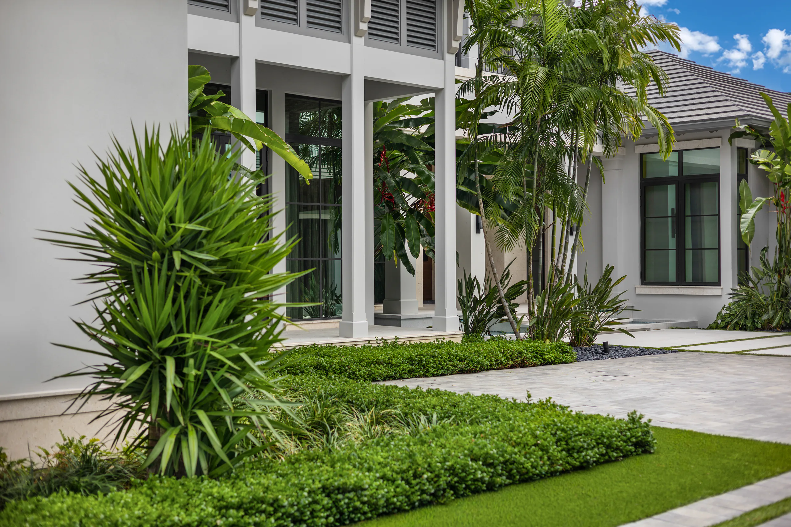 Clipped hedges and turf on a Palm Beach County property
